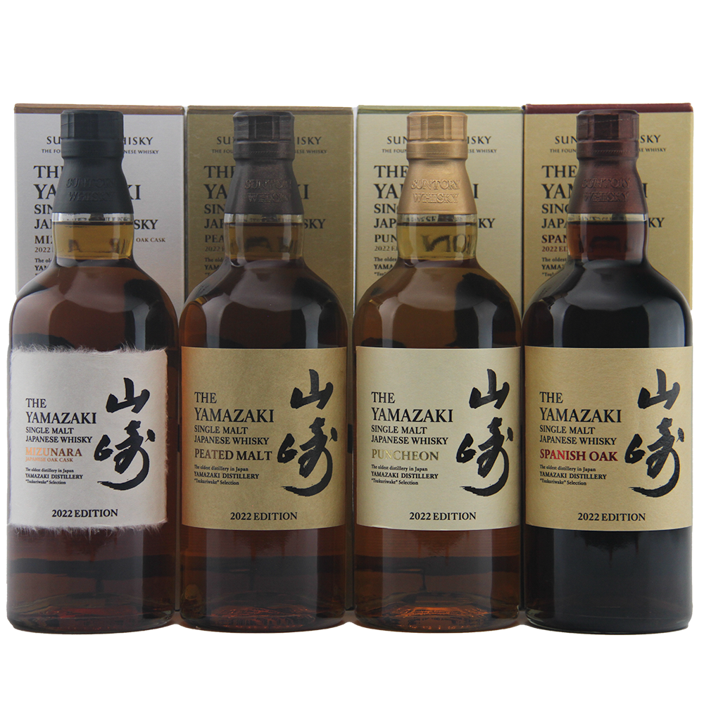 Four bottles of Yamazaki whisky with their packaging on a white background