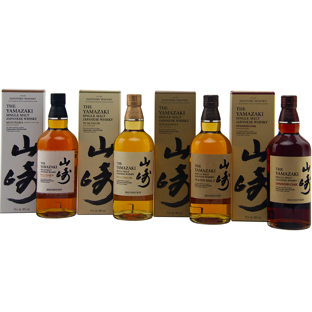 Four bottles of Yamazaki whisky with packaging on a white background