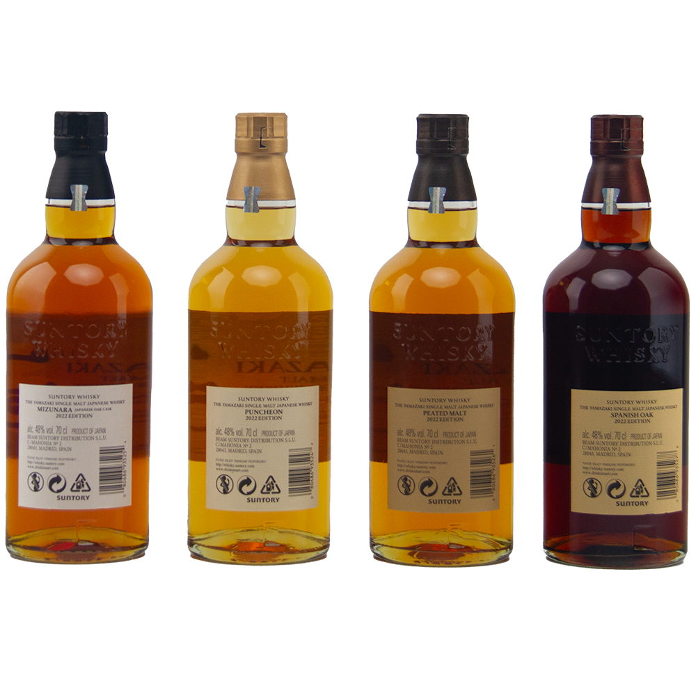 Four bottles of Yamazaki single malt whisky on a white background