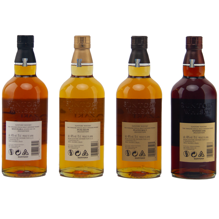 Four bottles of Yamazaki single malt whisky on a white background