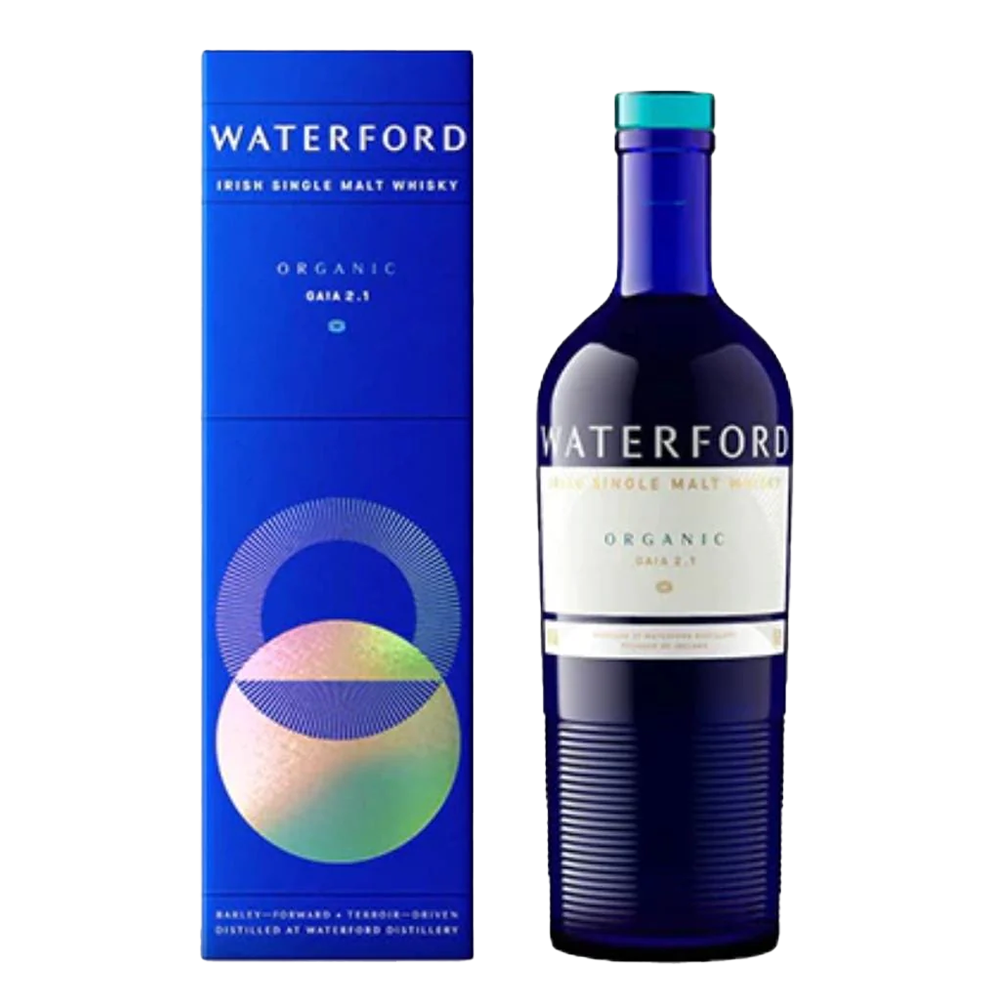 A blue bottle of Waterford Organic Gaia: Edition 2.1 Single Malt Whisky, made from organic Irish barley, stands beside its matching blue cylinder box adorned with colorful geometric patterns and organic-inspired text.