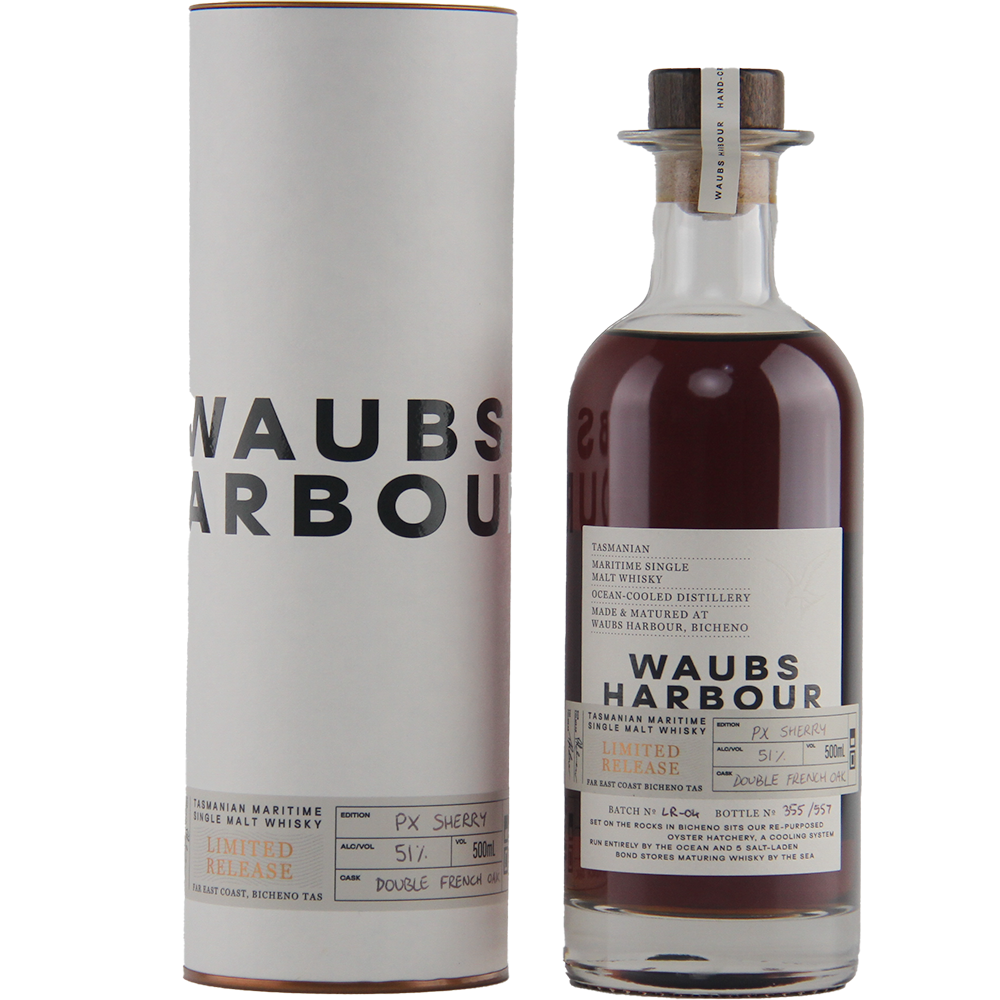 A bottle of Waubs Harbour PX Sherry Cask Single Malt Australian Whisky, dark amber in color, stands beside its white cylindrical box featuring bold black lettering and a detailed white label with black text.