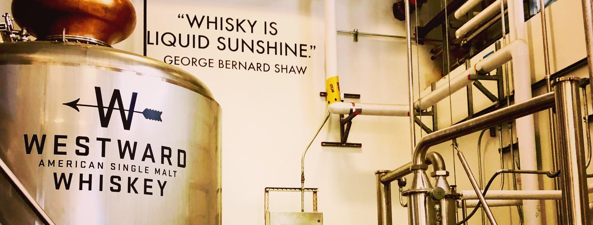 Westward American Single Malt Whiskey still with a quote on the wall.