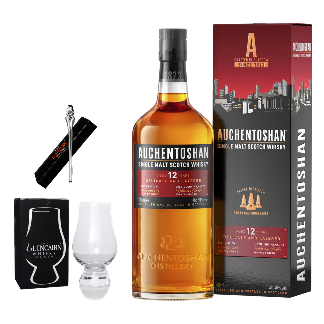 The Whisky Essentials Gift Set – Auchentoshan 12 Year Old, Glencairn Pipette & Glencairn Glass includes a bottle of Auchentoshan 12, a Glencairn glass with its box, a pipette, and cleaning brush—a perfect whisky gift set.