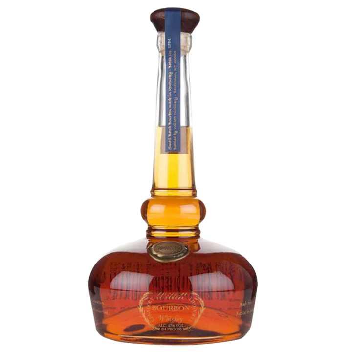 A bottle of Willett Family Pot Still Reserve Bourbon Whiskey features a round base, long neck, dark cap, and vertical blue neck label. The amber whiskey inside is clearly visible.