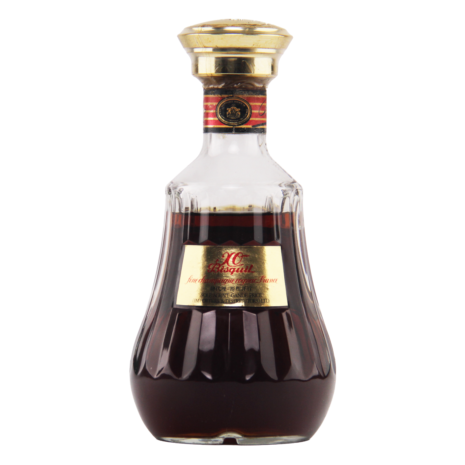 Bottle of X.O. Brandy with a gold cap and label on a white background