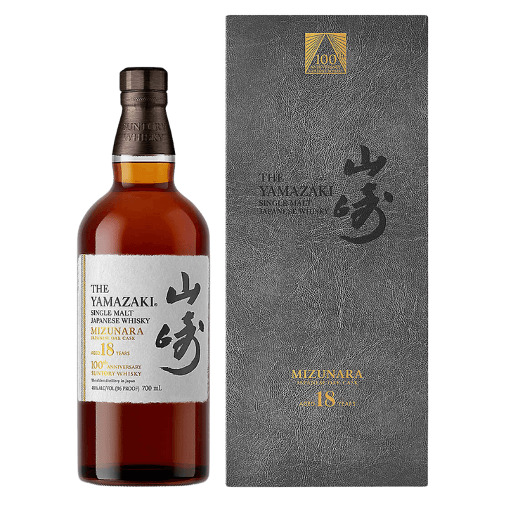 Yamazaki whisky bottle and packaging on a green background