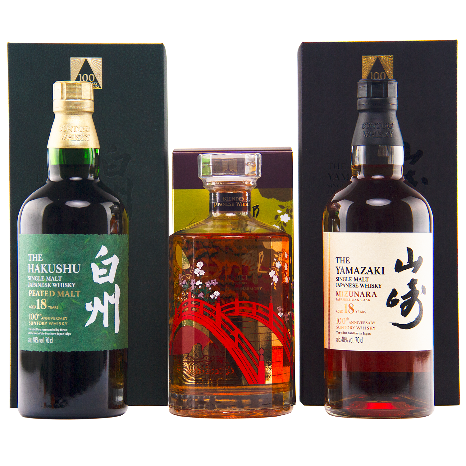Three bottles—Yamazaki 18, Hakushu 18, and the Hibiki 100th Anniversary Set—are displayed in front of their boxes.