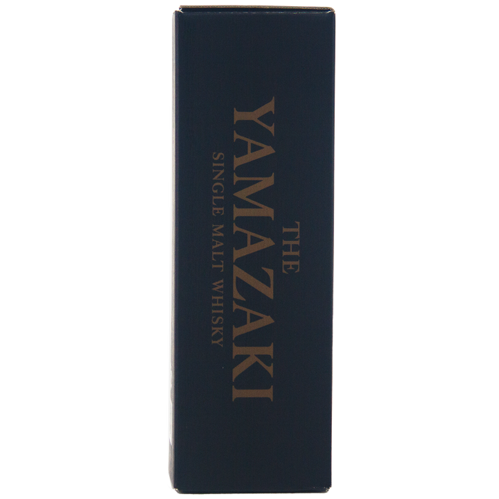 A dark blue rectangular box with gold text reading Yamazaki 18 Year Old Japanese Single Malt Whisky vertically along the side.
