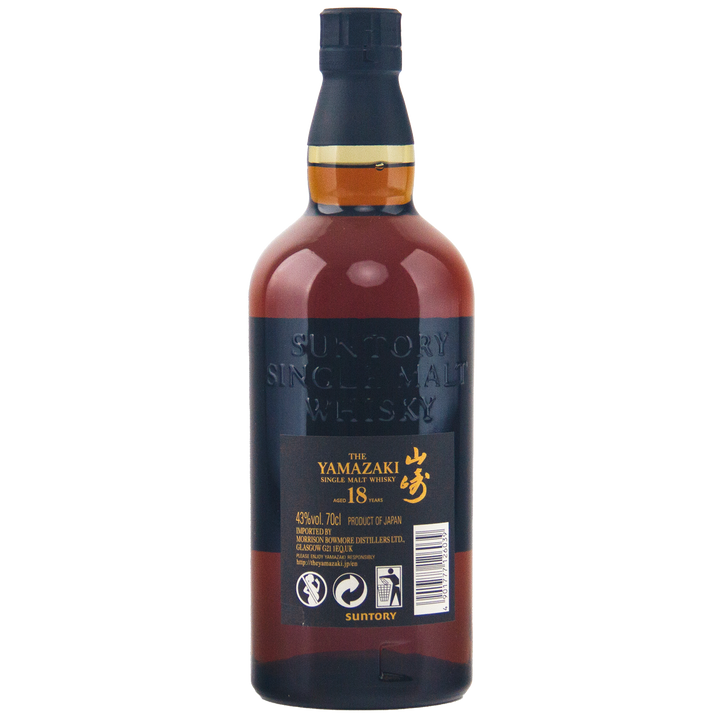 A bottle of Yamazaki 18 Year Old Japanese Single Malt Whisky, with its dark amber hue, black and gold label, and gold Japanese characters, stands elegantly against a white background.