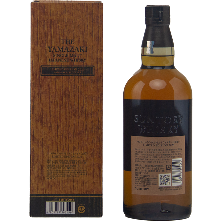 Suntory Whisky bottle and wooden box on a white background