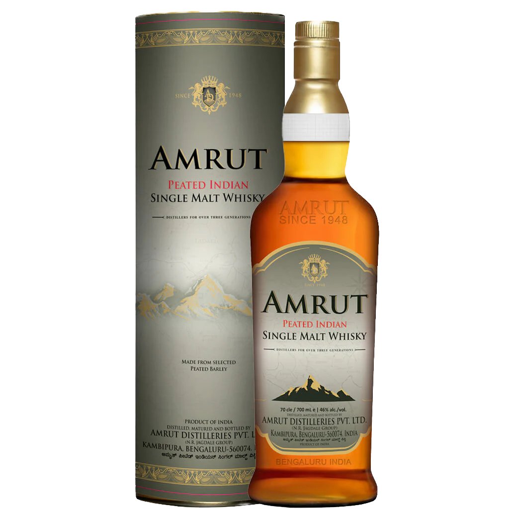 A bottle of Amrut Peated Indian Single Malt Whisky stands next to its cylinder, both adorned with mountain art and gold, black, and red text on a cream background—an elegant display for this peated single malt.