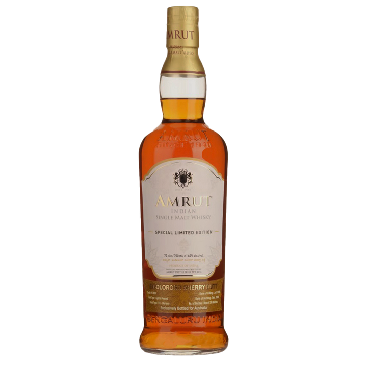 A bottle of Amrut Oloroso Cask #3897 Indian Single Malt Whisky, sherry cask matured, with a gold and cream label featuring black and gold text, and amber whisky inside.