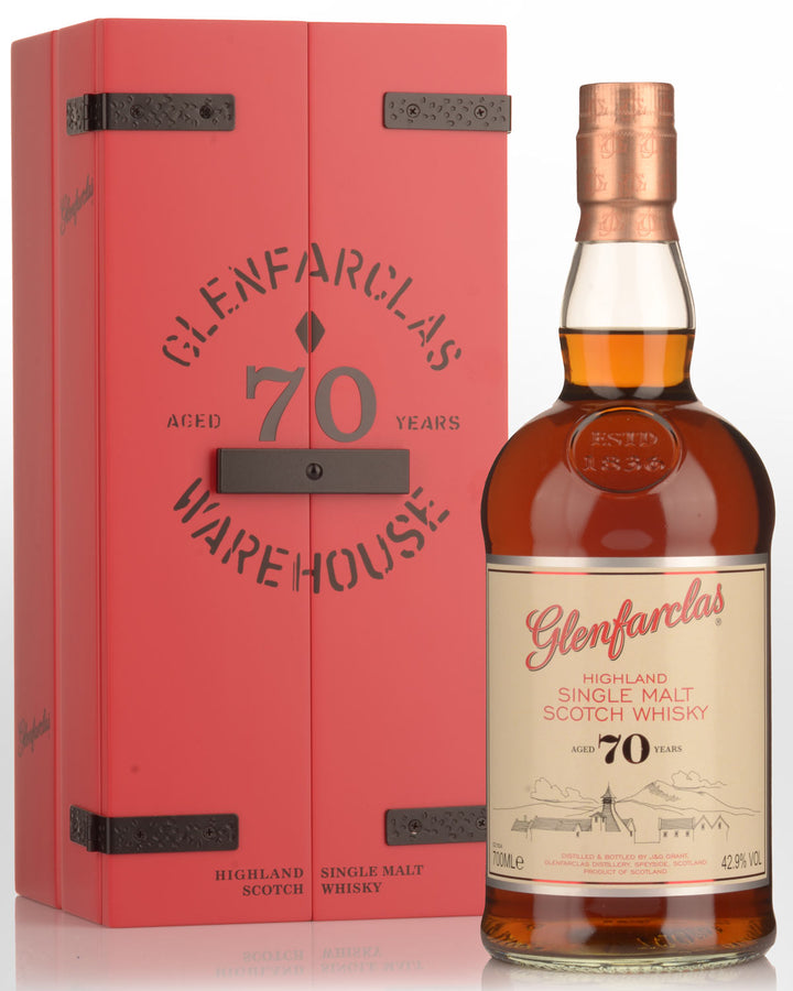Glenfarclas 70-year-old whisky bottle and box on a white background
