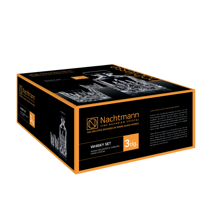 A black and orange Nachtmann box presents the Nachtmann Noblesse Whisky Decanter Set—premium Bavarian crystal decanter with glasses. "WHISKY SET" and "3 tlg." are highlighted, with product info and branding on several sides.