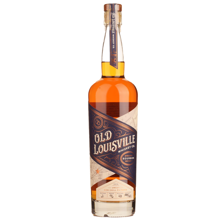 A bottle of Old Louisville Whiskey Co. Straight Bourbon Whiskey Batch 2, with a navy and gold diagonal label, decorative accents, amber whiskey inside, and sealed with a wax-topped cork.
