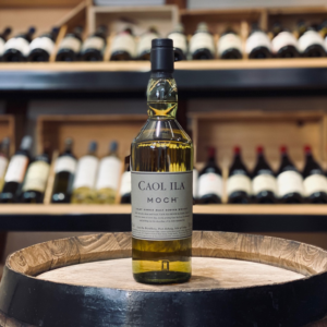 Caol Ila Moch Single Malt Scotch Whisky bottle from Islay, in a wine and whisky room - Whisky Estate