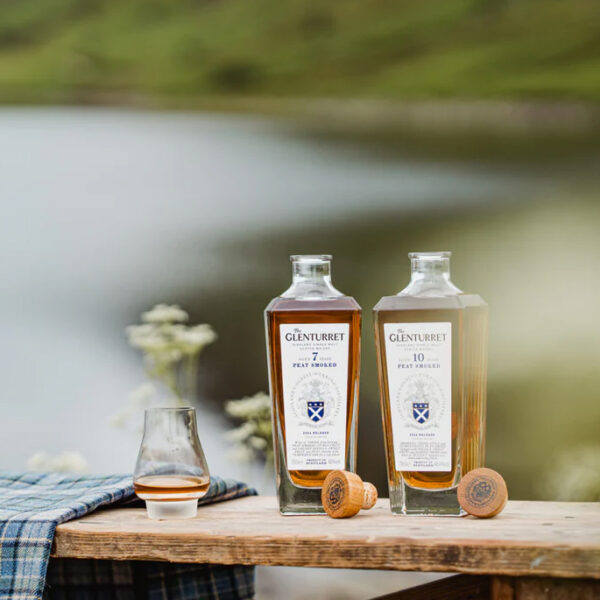 The Glenturret 7 year old and 10 year old peat smoked single malt scotch whiskies enjoyed by the water in Speyside, Scotland - Whisky Estate