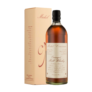 "Michel Couvreur Overaged whisky bottle and box set available at Whisky Estate, featuring a refined design that highlights its exceptional maturation process. The clear glass bottle showcases the deep amber whisky, while the elegant box enhances the presentation, reflecting its complex flavor profile with notes of dried fruit, rich spices, and a hint of oak, offering a luxurious tasting experience."