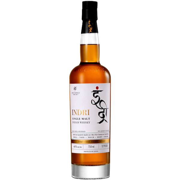 "Indri Trini Single Malt Indian Whisky bottle and box available at Whisky Estate, featuring a sleek, tall amber glass bottle showcasing this unique Indian single malt. The stylish packaging highlights its triple-cask maturation in ex-bourbon, French wine, and PX sherry casks, resulting in a complex profile with notes of honey, dried fruit, and subtle spices."